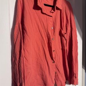 Woman’s Coral Button-Up shirt.